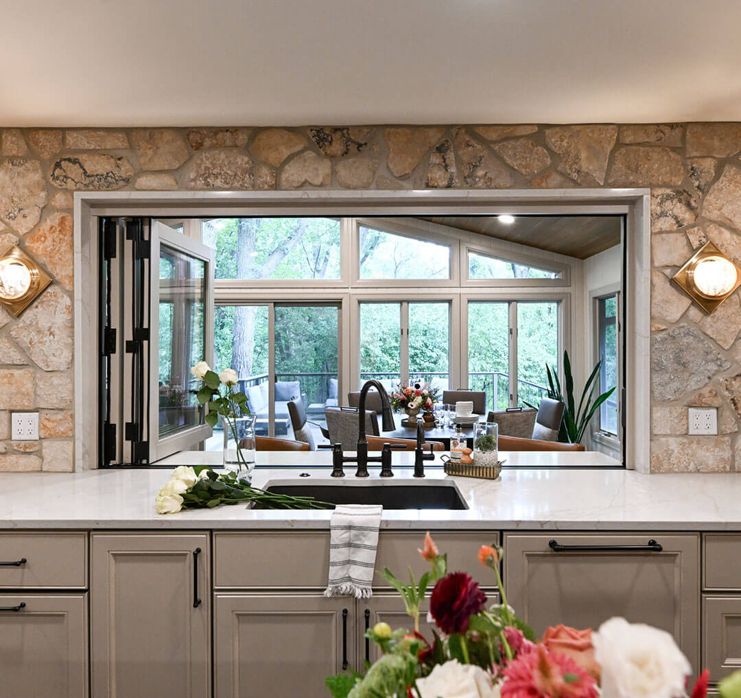Stone pass-through window over the kitchen sink